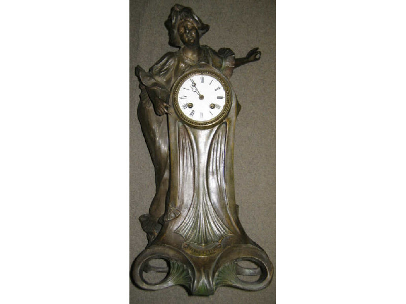 Appraisal: SPELTER FIGURAL CLOCK After L' Heure S'Envole Par Flora plaque