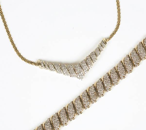 Appraisal: A pave set diamond and gold S bracelet together with