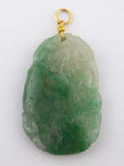 Appraisal: A carved jade pendant with yellow metal tests carat gold