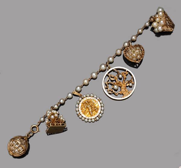 Appraisal: A cultured pearl diamond and fourteen karat gold charm bracelet