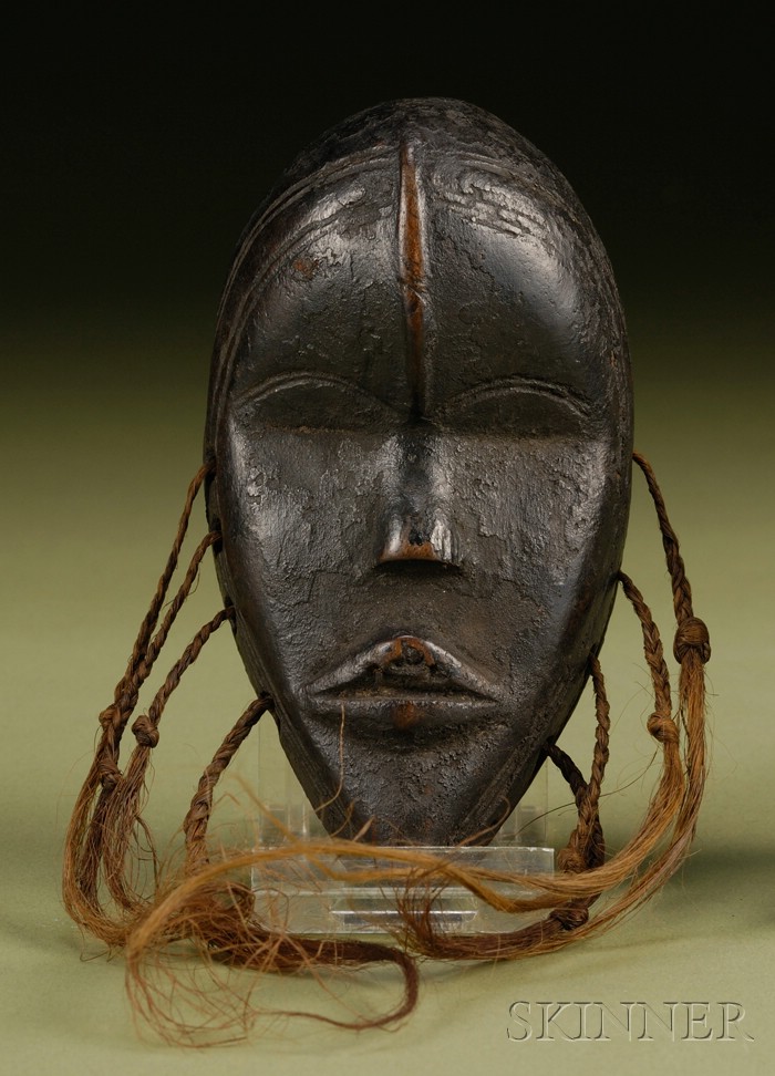 Appraisal: African Carved Wood Passport Mask Dan with ridged forehead delicate