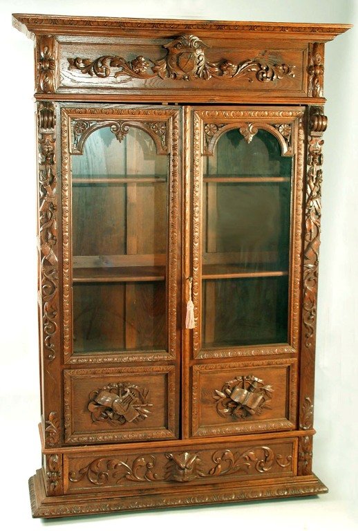 Appraisal: A late Victorian oak and walnut music or curio cabinet