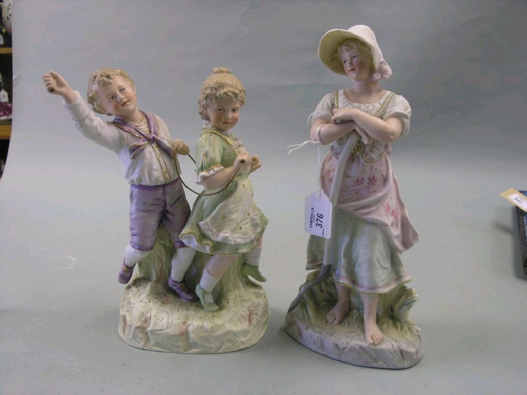 Appraisal: Two late th century French bisque figures boy and girl