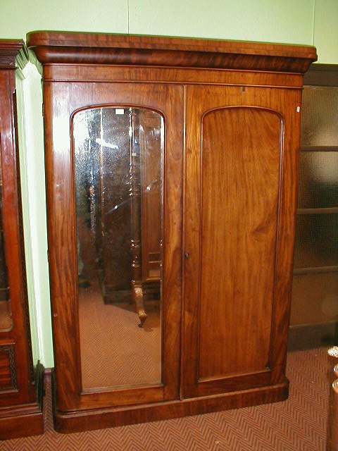 Appraisal: A Victorian mahogany two door wardrobe press with mirror door