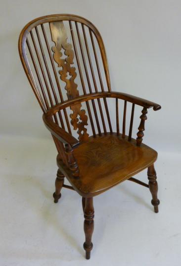 Appraisal: A YEW WINDSOR ARMCHAIR Yorkshire th Century of high double