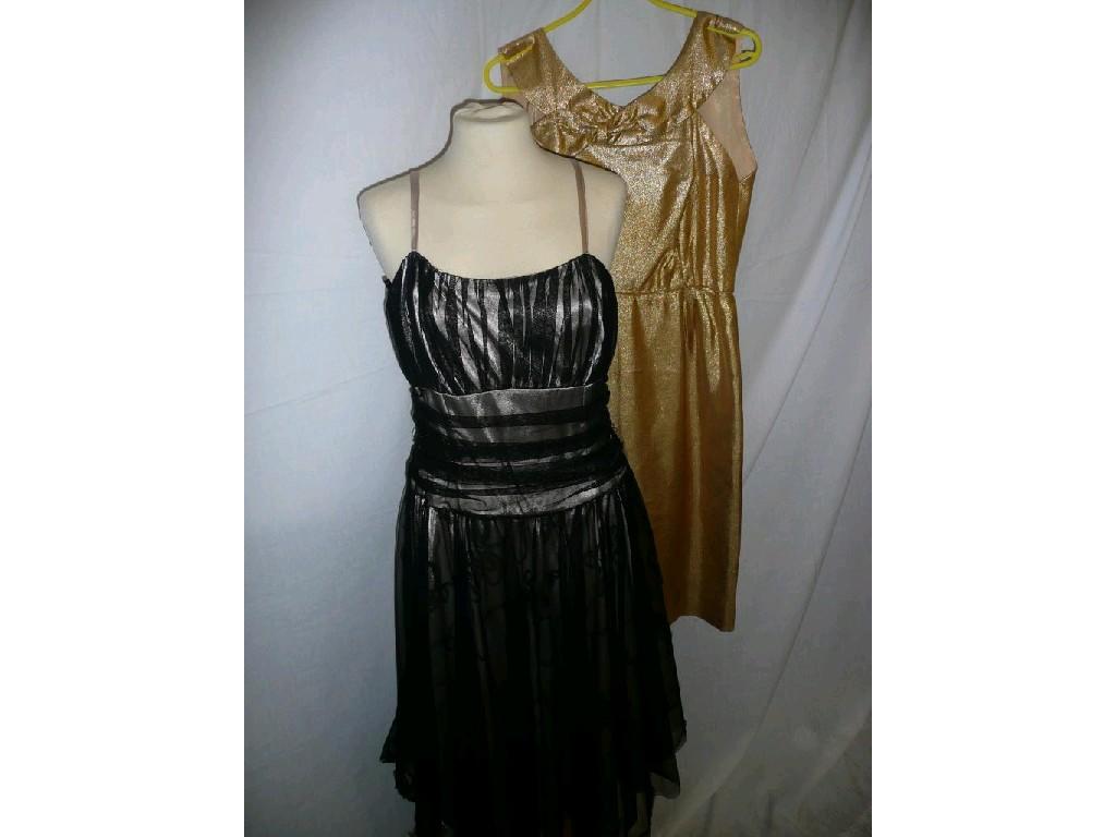 Appraisal: A gold vintage cocktail dress sleeveless round neck with bow