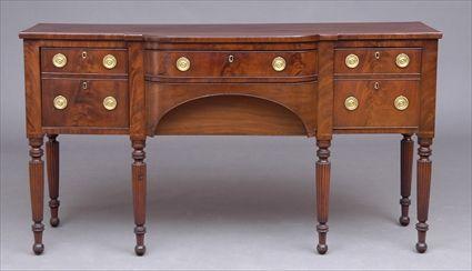 Appraisal: BOSTON FEDERAL CARVED MAHOGANY BREAKFRONT SIDEBOARD The shaped top above