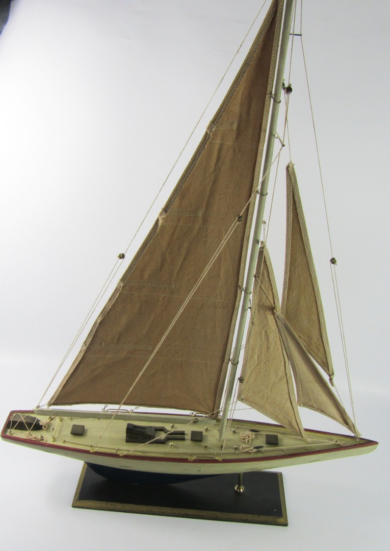 Appraisal: A wooden model of a single masted yacht on a