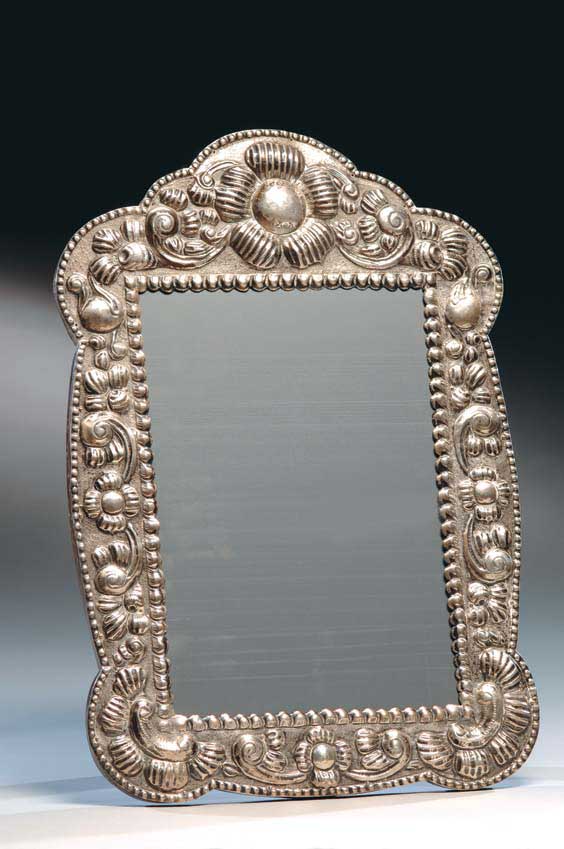 Appraisal: LARGE PERUVIAN SILVER MIRROR Large Peruvian repouss silver mirror with