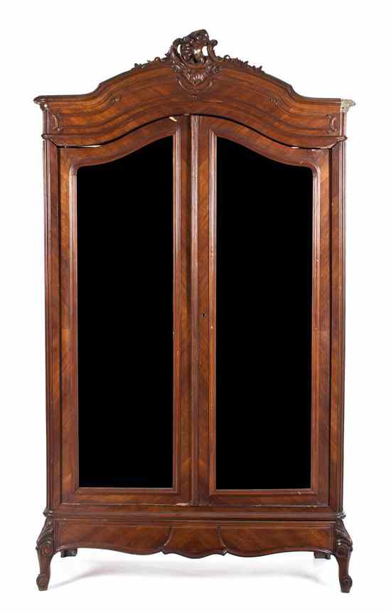 Appraisal: A Louis XV Style Mahogany Armoire having a foliate carved