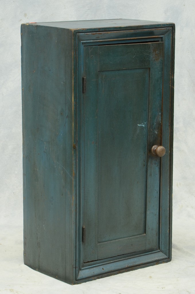 Appraisal: Blue painted one door wall cupboard picture frame molding around