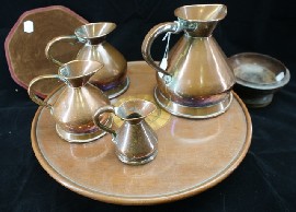 Appraisal: A graduated set or farrow and Jackson copper jugs together