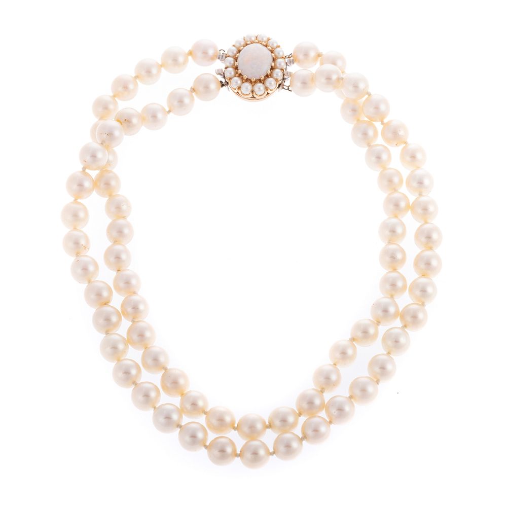 Appraisal: A Double Strand of Pearls with Opal Clasp Double strand