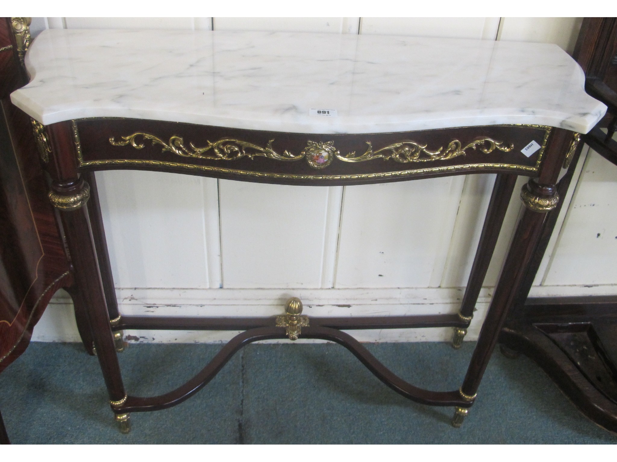 Appraisal: A reproduction marble topped hall table