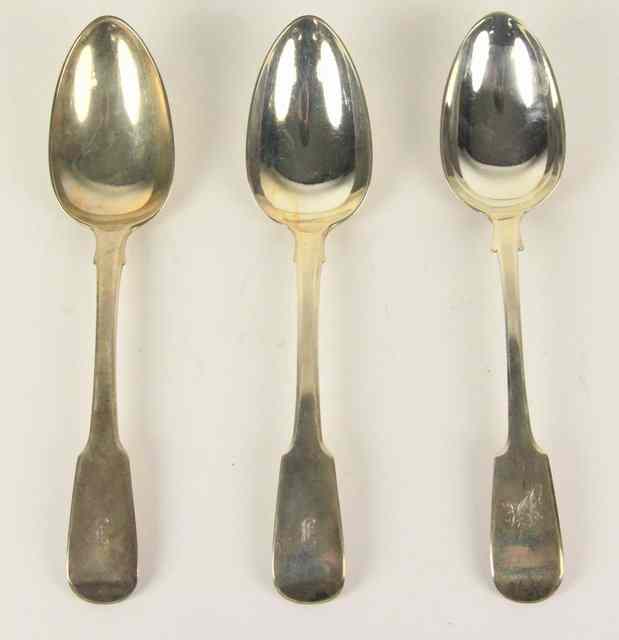 Appraisal: A pair of silver table spoons London initialled and a