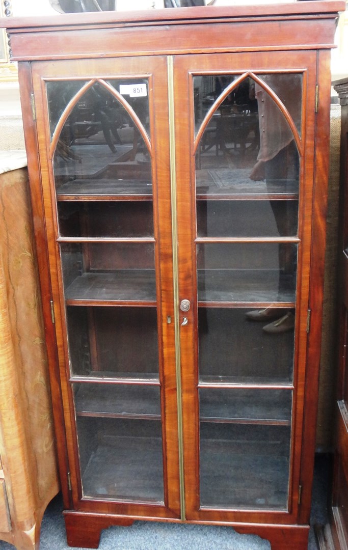 Appraisal: A th century mahogany floor standing bookcase with a pair