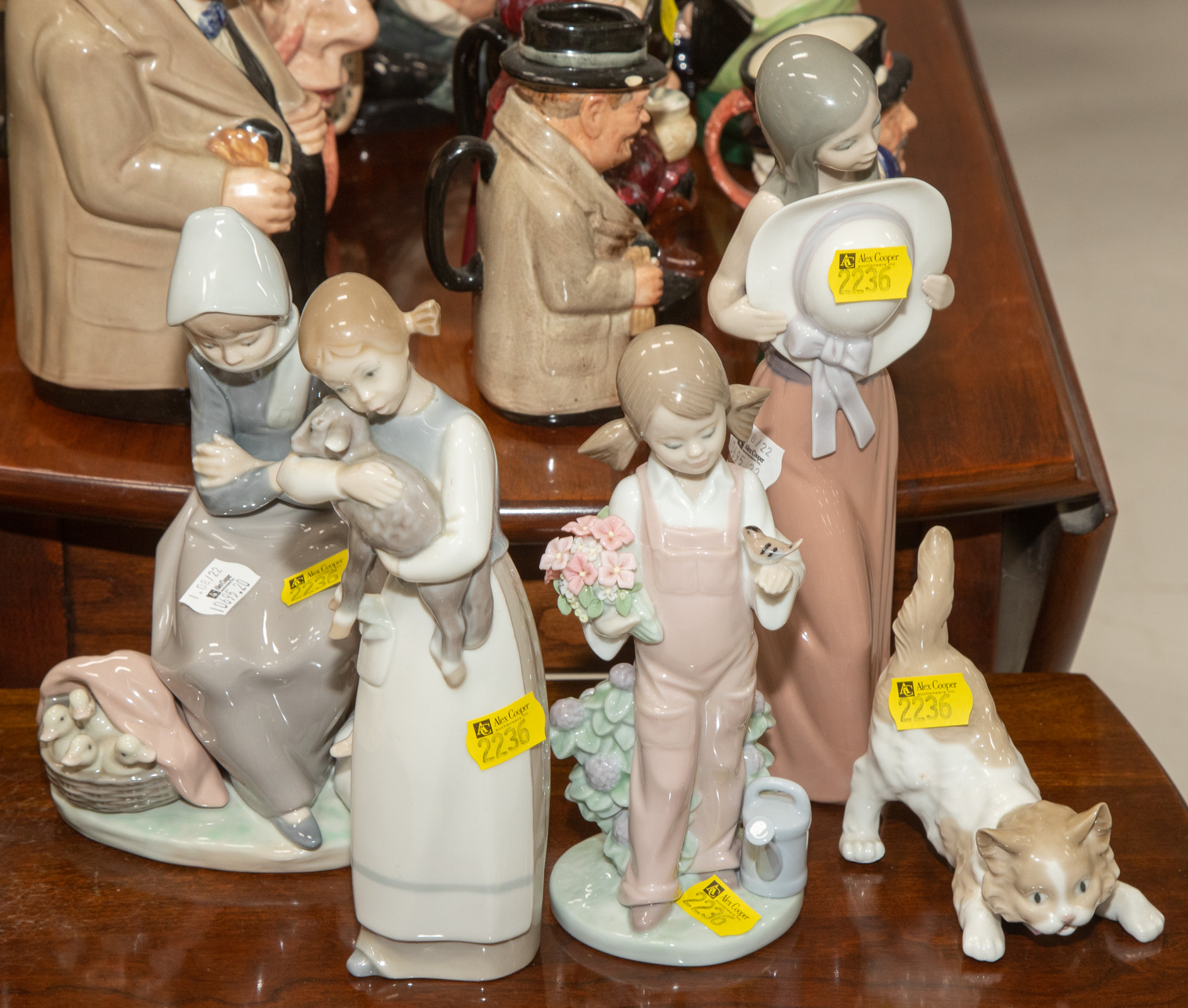 Appraisal: FIVE LLADRO FIGURES Includes a girl with a lamb in