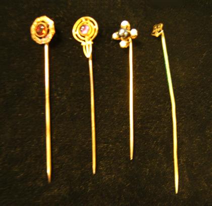 Appraisal: Group of four gold stick pinsOf varying gold karat and