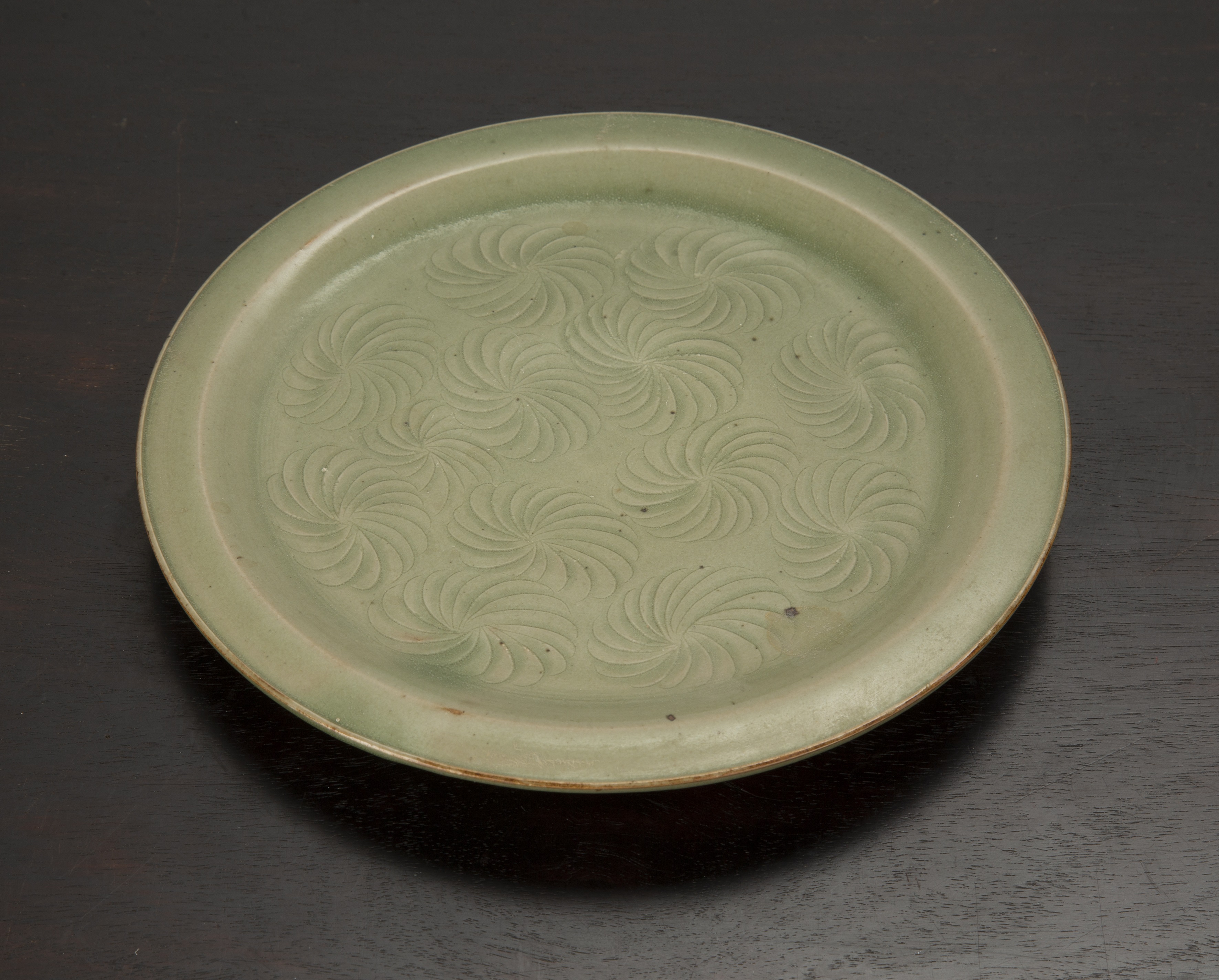 Appraisal: Celadon plateChinese decorated with concentric style decoration to the centre