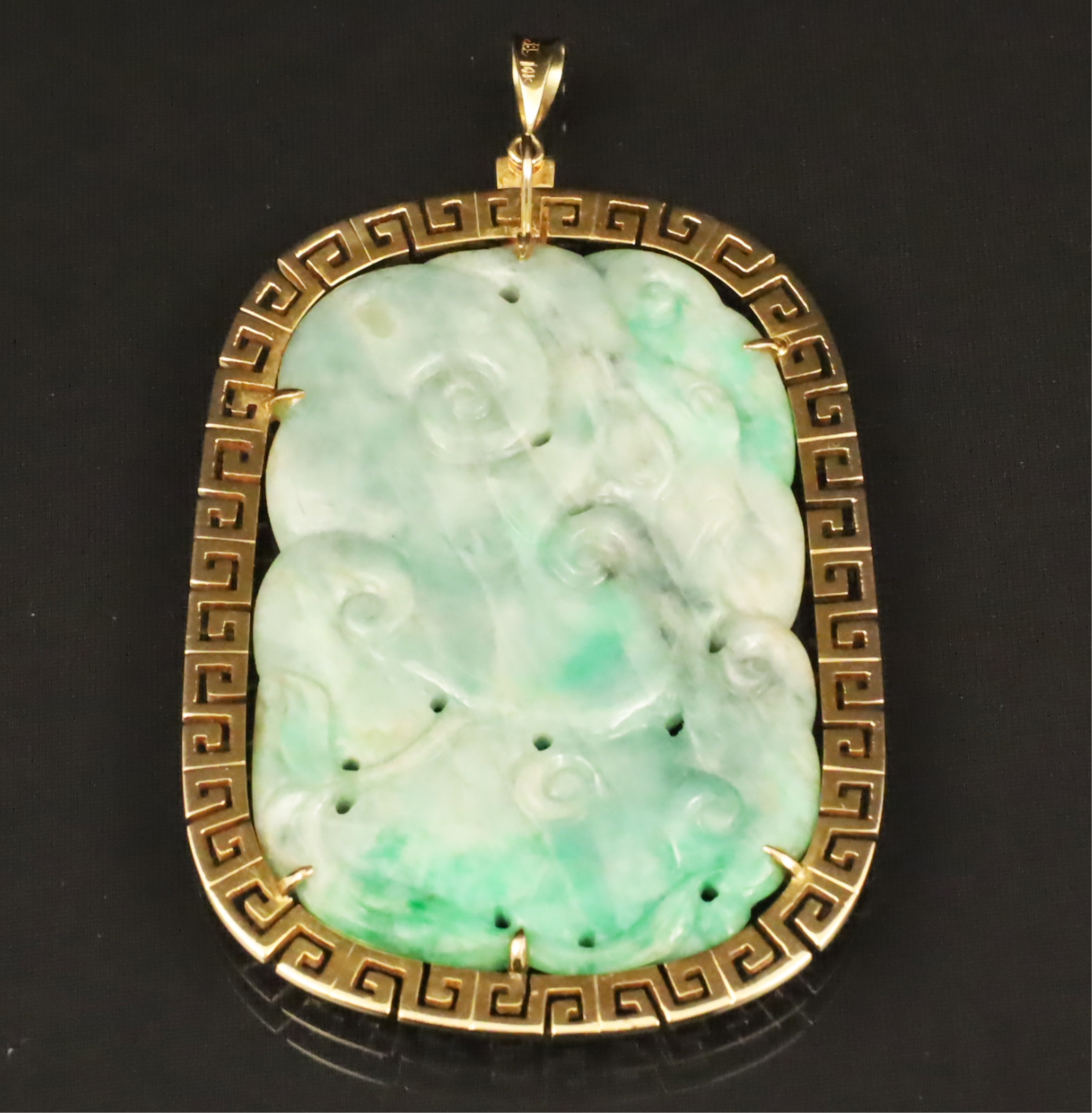 Appraisal: K MTD NEPHRITE OVAL PENDANT WITH RAISED RELIEF Green and