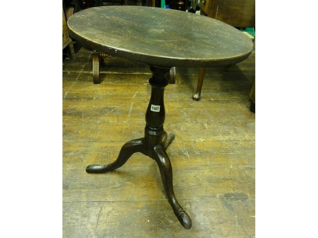 Appraisal: A Georgian oak occasional table with later associated circular snap