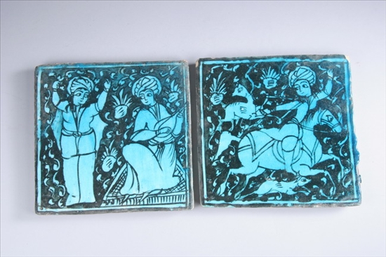 Appraisal: PAIR ISLAMIC TURQUOISE AND BLACK FAIENCE TILES th century Painted