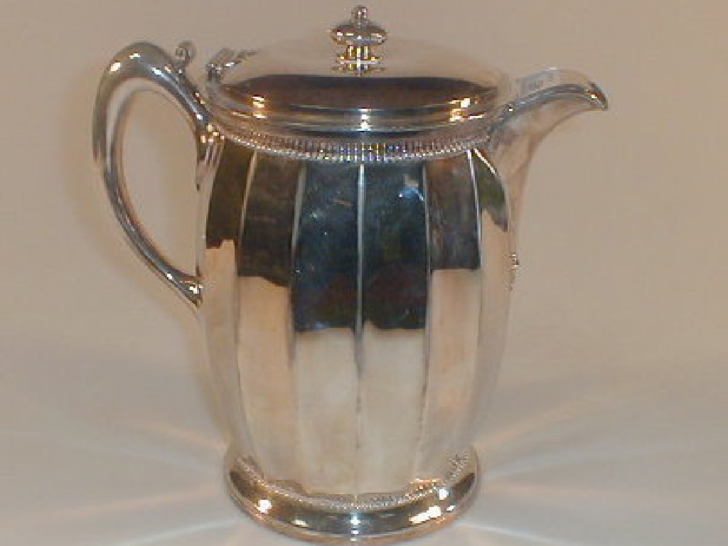 Appraisal: A lined electroplate serving jug marked 'Meridon Co USA'