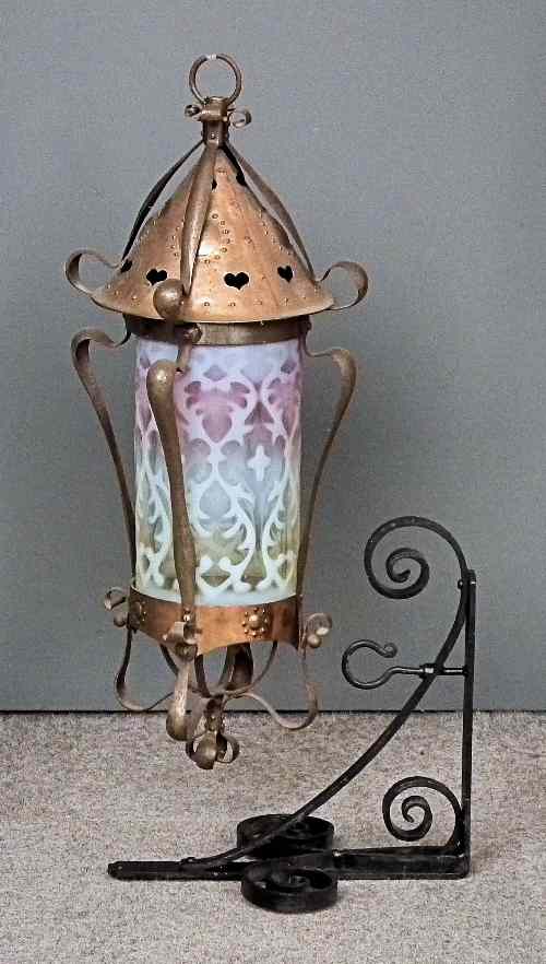 Appraisal: A late Victorian wrought iron and copper mounted cylindrical lantern