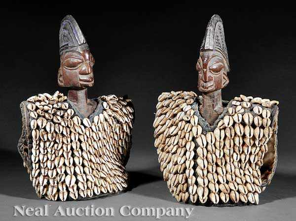 Appraisal: Two African Carved Wood Ibeji Figures in Cowrie Shell Vests