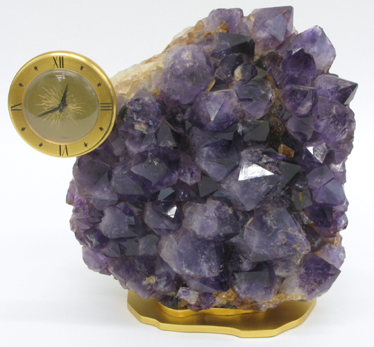 Appraisal: NATURAL AMETHYST QUARTZ CRYSTAL with small wind-up clock in gilt