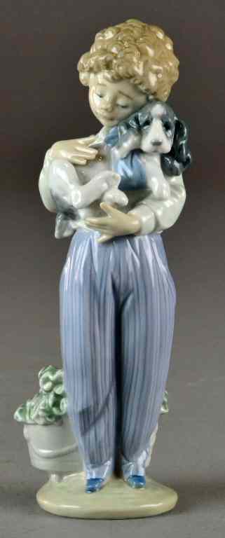 Appraisal: Lladro Figurine ''Sick Doggie''Young boy holding his dog with a