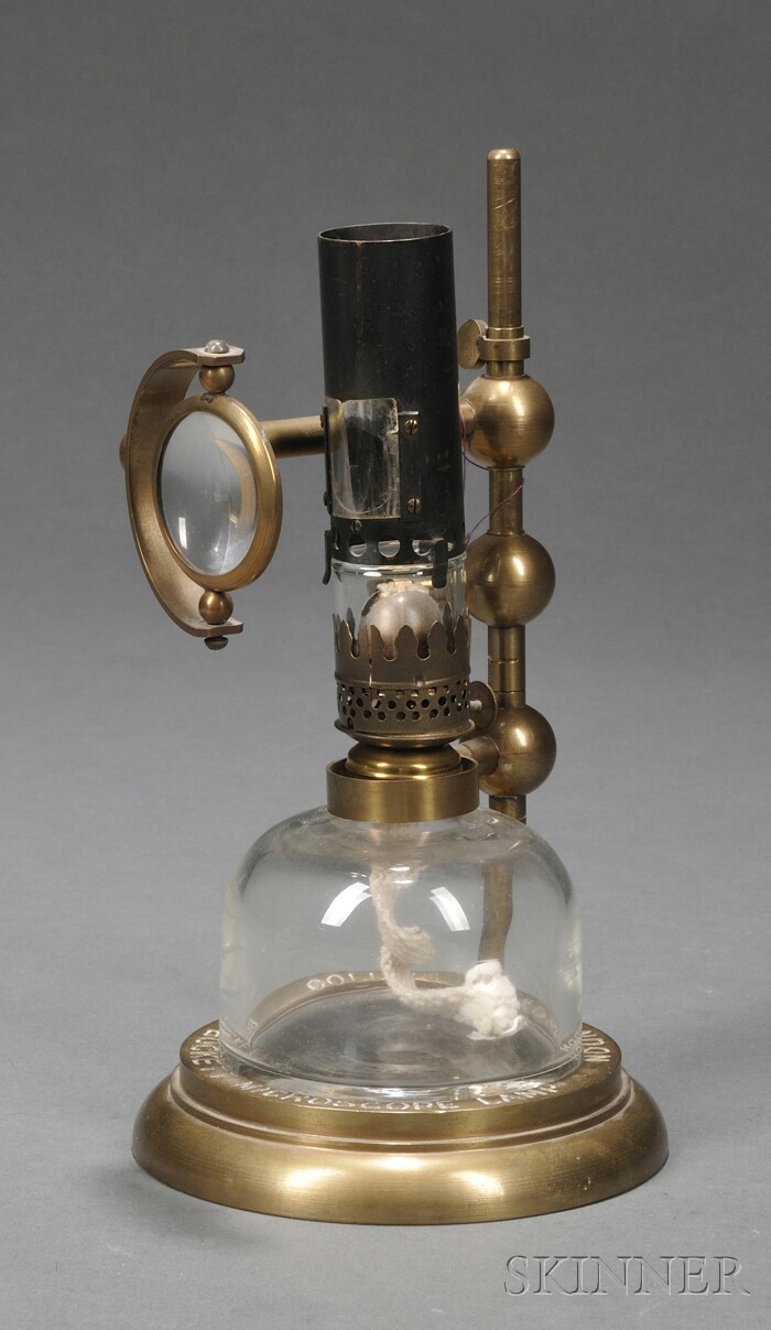 Appraisal: Bockett Microscope Lamp London early th century brass ring-form base