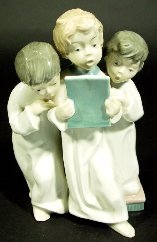 Appraisal: Sitzendorf porcelain figure group of three choirboy angels each with