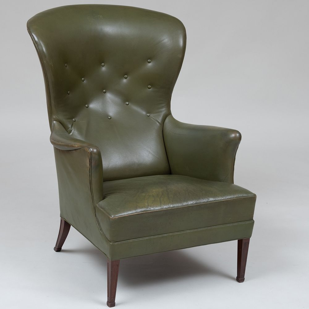 Appraisal: Danish Mahogany and Green Leather Upholstered Wing Armchair Attributed to