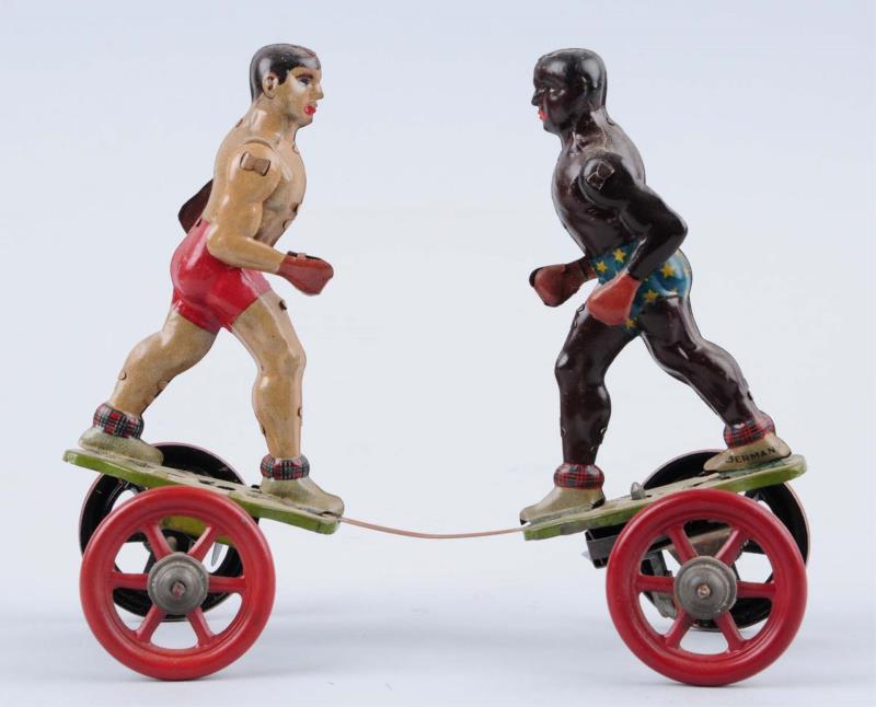 Appraisal: German Tin Litho Wind - Up Boxing Toy Made around