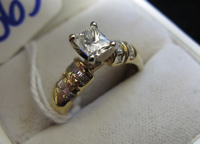 Appraisal: DIAMOND AND FOURTEEN KARAT GOLD RING centering a rectangular princess-cut