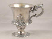 Appraisal: A Georgian sterling silver Campania shaped christening cup with embossed