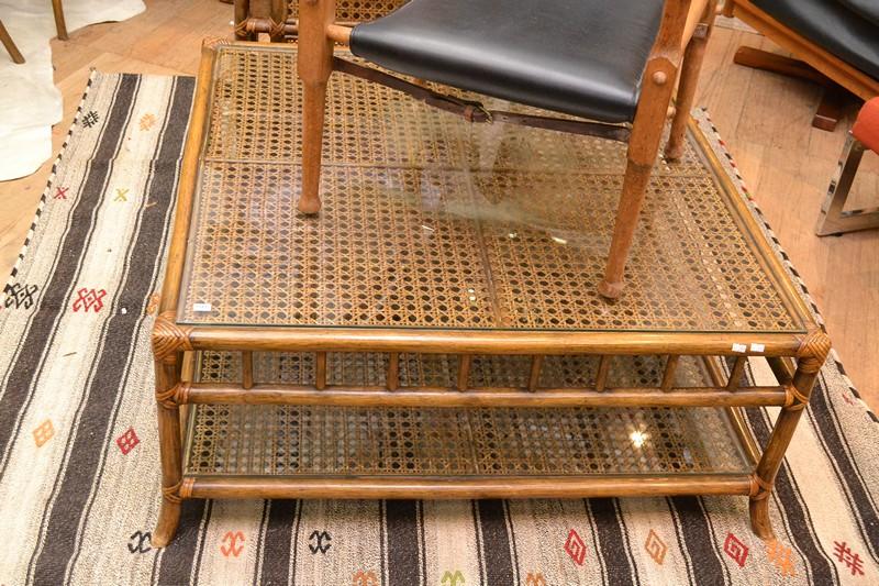 Appraisal: A TWO TIER CANED COFFEE TABLE WITH GLAZED TOPS A