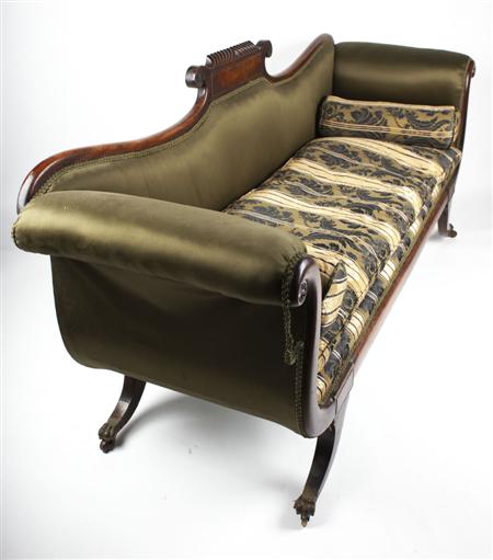 Appraisal: REGENCY MAHOGANY AND UPHOLSTERED SETTEE CIRCA the fluted scroll back