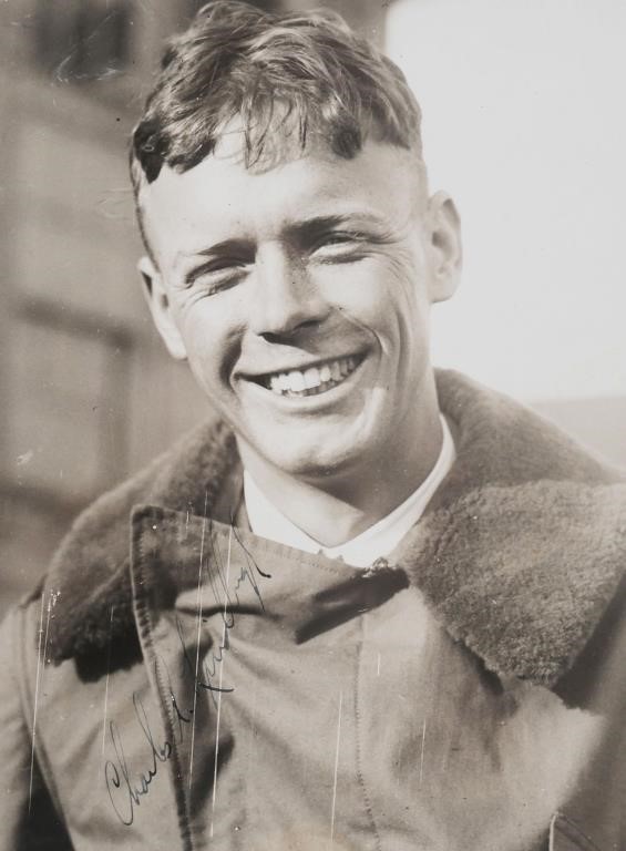 Appraisal: Photograph Trans-Atlantic aviator Charles Lindbergh in flight gear Signed at