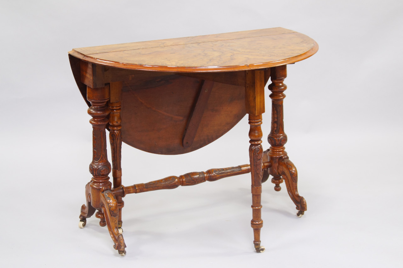 Appraisal: A Victorian walnut Sutherland table with leaf and line inlay