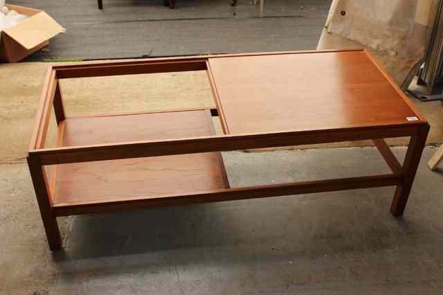 Appraisal: A CONTEMPORARY TEAK POSSIBLY DANISH LOW OCCASIONAL TABLE with glass