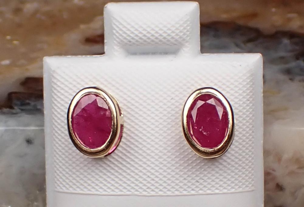 Appraisal: PAIR OF RUBY AND FOURTEEN KARAT GOLD EAR STUDS each