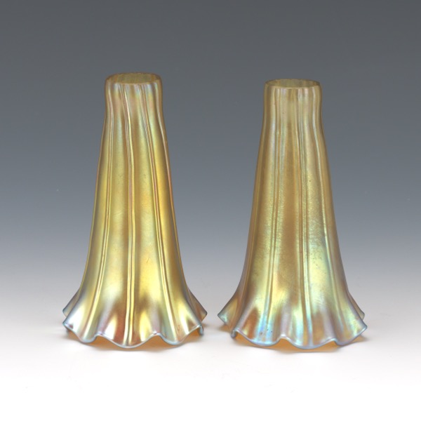 Appraisal: PAIR OF GOLD IRIDESCENT SHADES Two floriform gold iridescent glass