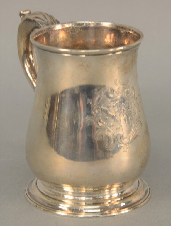 Appraisal: English silver mug with scrolled handle and coat of arms