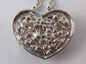 Appraisal: A white metal tests carat gold diamond set heart pendant