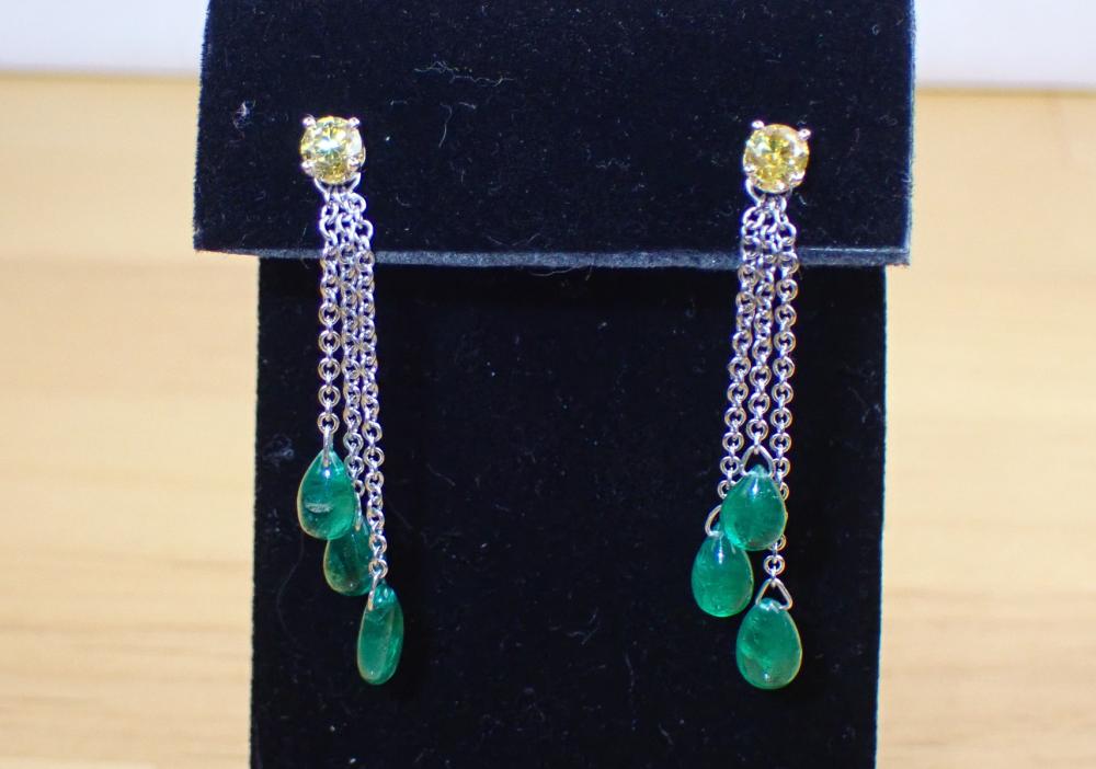 Appraisal: YELLOW DIAMOND EAR STUDS WITH EMERALD EARRING ENHANCERS The k