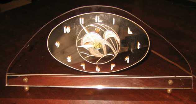 Appraisal: GENERAL ELECTRIC ART DECO CLOCK arched glass with gilt metal