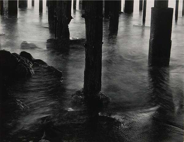 Appraisal: Wynn Bullock Pilings under a Building Gelatin silver print signed