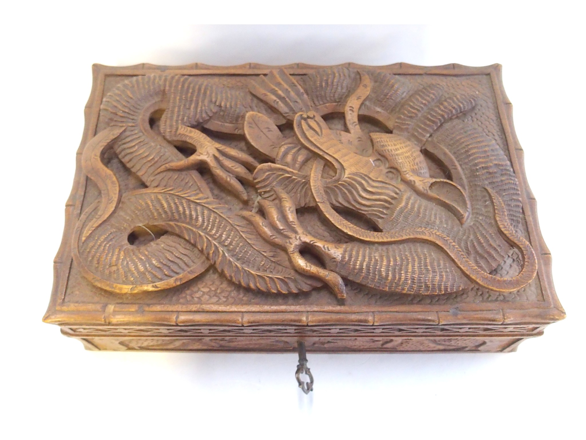 Appraisal: A Chinese carved wood box the lid with four clawed